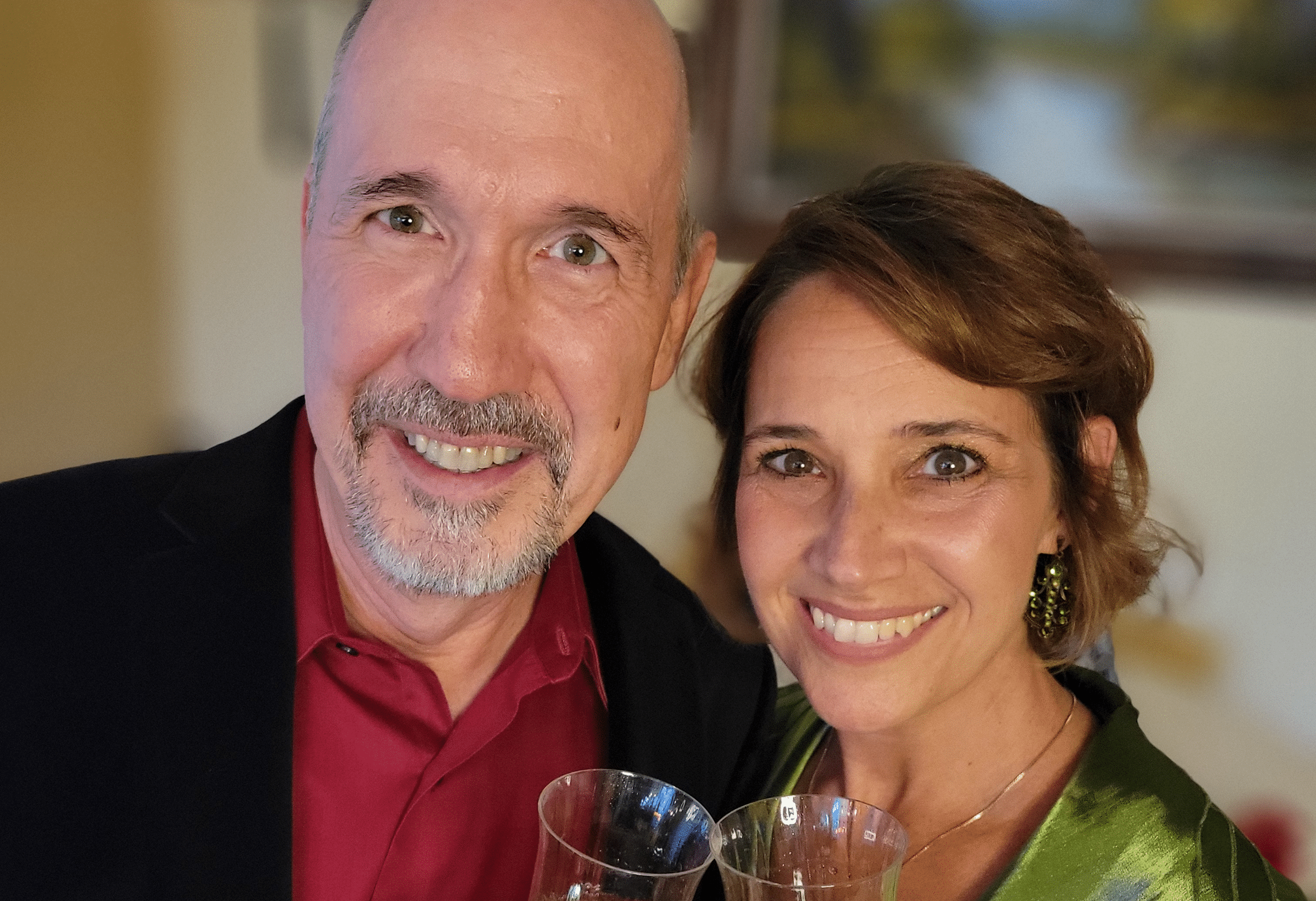 Brian Runbeck and Shana Bousard clink champagne glasses
